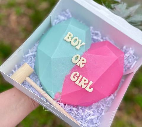Pink and blue chocolate gender reveal heart with text: BOY OR GIRL