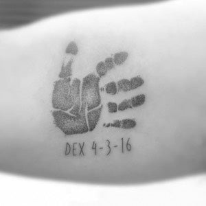 Parent tattoo ideas: Baby handprint tattoo