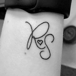 Tattoo ideas for parents: child's initials tattoo