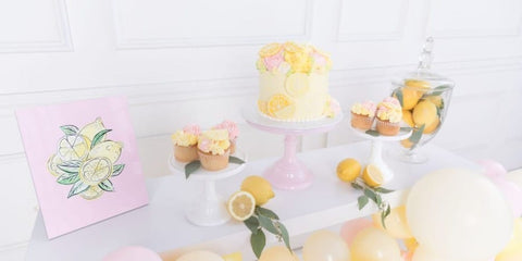 Cake and cupcake decorated with icing lemons for a summer baby shower