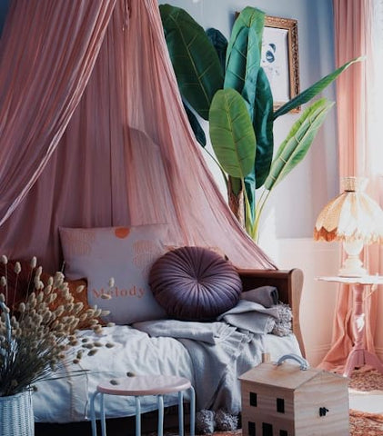 Sophisticated looking toddler room with a mauve color scheme.