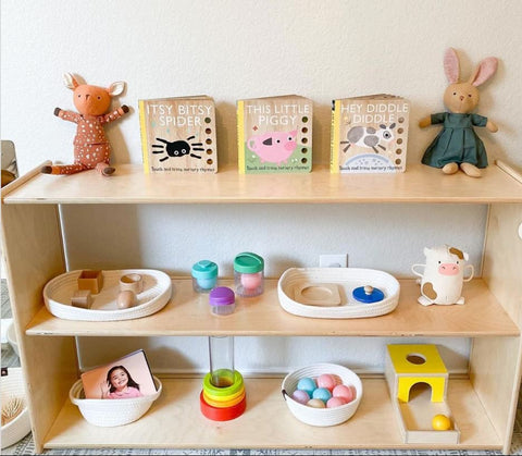 Low-shelf with baby toys