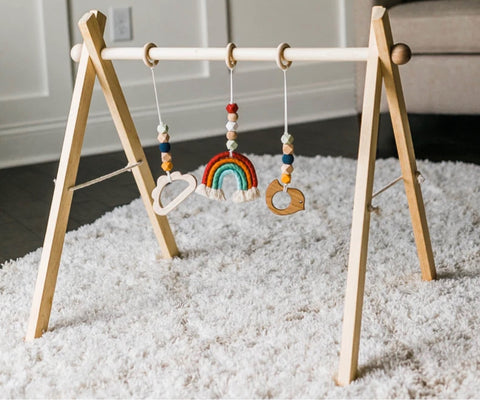 Montessori-style wooden play gym for babies