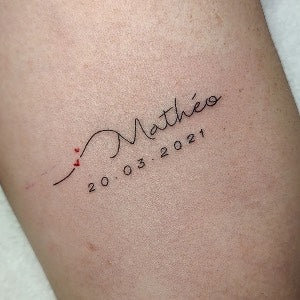 Tattoo ideas for parents: Name and birthdate tattoo