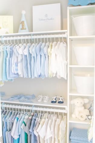 Light and bright organized nursery closet