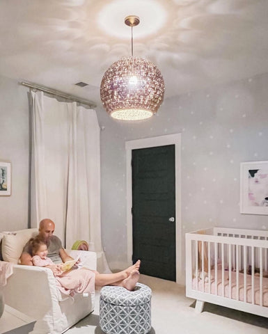 A woven pendant light in a baby's nursery