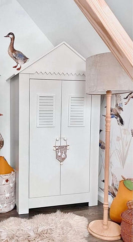 White armoire in a baby nursery