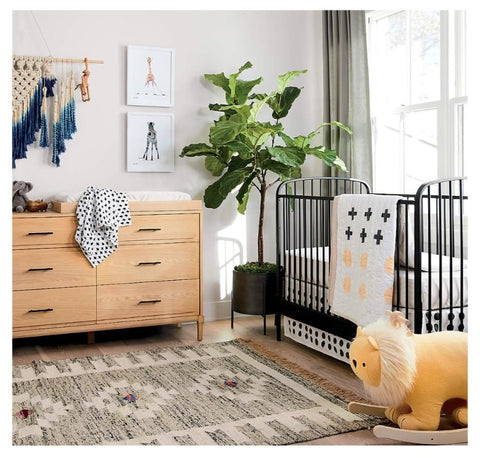 A textured nursery rug in a baby's room