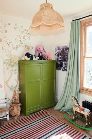 Nursery with dramatic sweeping window treatment