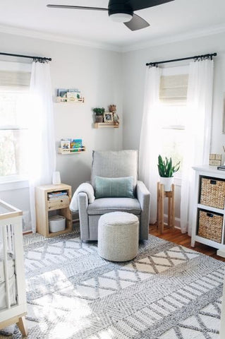 Baby room with a light and airy nursery window treatment