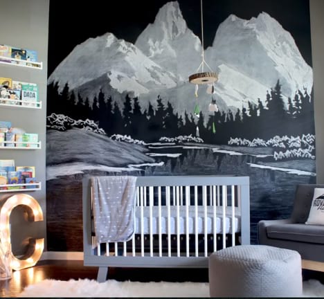 Outdoorsy nursery with mountain wallpaper