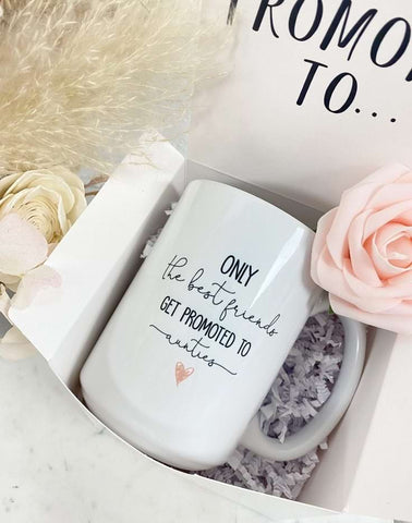 A pregnancy announcement coffee mug that says "only the best friends get promoted to aunties"