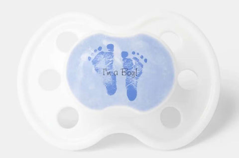 Pregnancy announcement pacifier that says "I'm a boy"