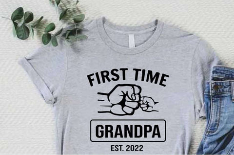 Pregnancy announcement t-shirt that says "first time grandpa, est 2022"