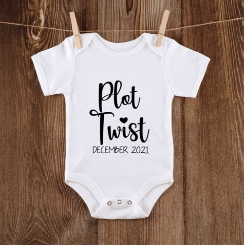 Pregnancy announcement onesie that says "Plot Twist"