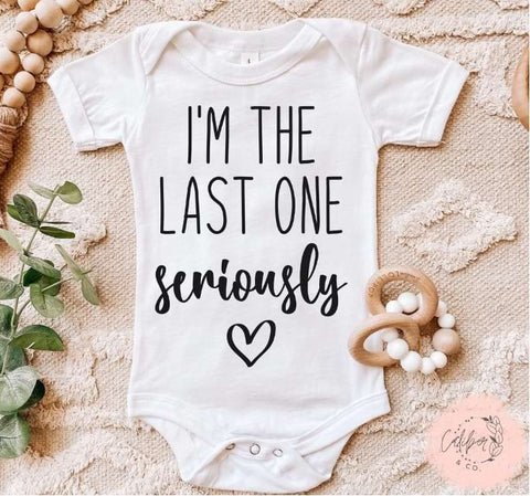 Pregnancy announcement onesie that says "I'm the last one seriously"