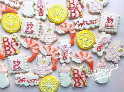 Cookies decorated as lemons and shrimp for a shrimp boil-themed baby shower
