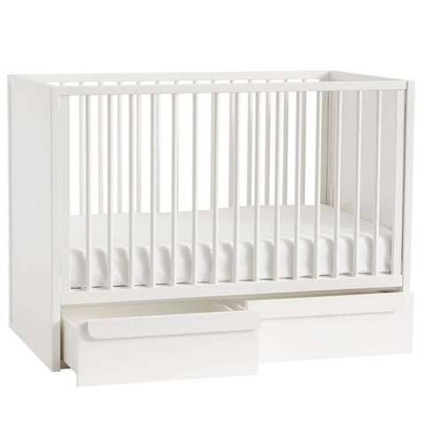 Crib with storage in the bottom.