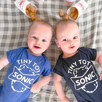 Twin babies in Sonic bodysuits