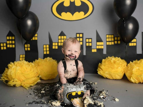 Baby and Batman-themed smash cake.