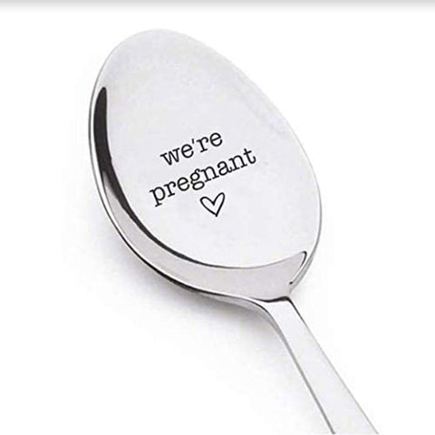 Spoon that says "we're pregnant"