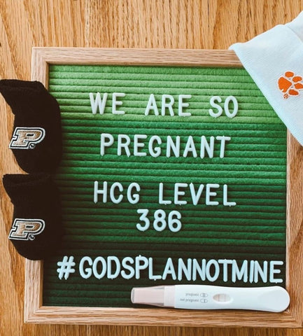 Letterboard listing HGC levels to announce IVF pregnancy