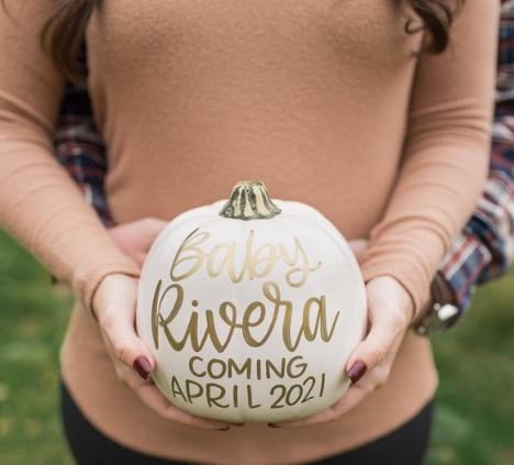 Pumpkin painted with pregnancy announcement