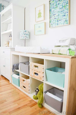 Upcycled bookshelf changing table in a baby nursery