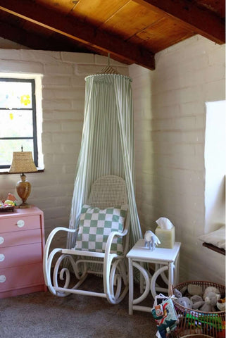 Upcycled nursery canopy and pillow made from old fabric scraps