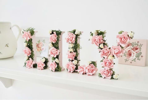 Name spelled out with flowers in a baby nursery