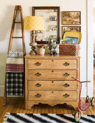 Upcycled vintage ladder used as a blanket rack in a nursery