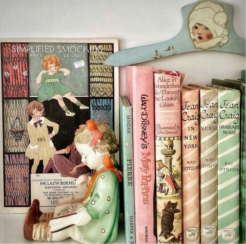 Vintage nursery accessories on a bookshelf