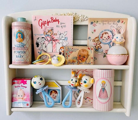 Vintage trinkets displayed on a nursery shelf