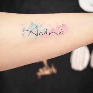 Parent tattoo ideas: watercolor name tattoo