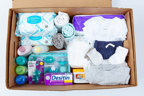 Welcome baby box filled with baby essentials.