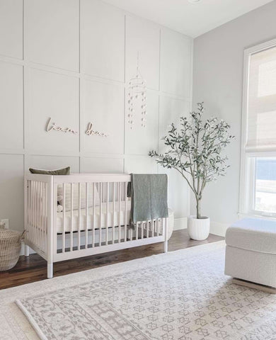 Elegant all-white baby nursery