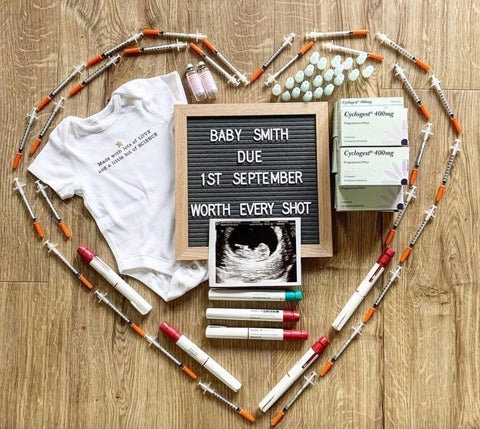 IVF pregnancy announcement made with needles arranged in a heart-shape