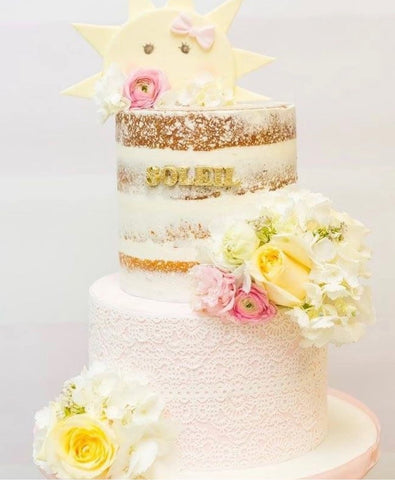 Cake decorated with a sunshine topper