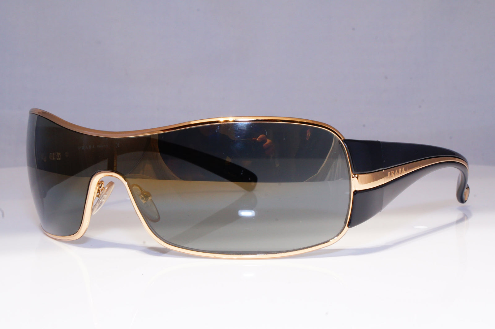 prada sunglasses black and gold