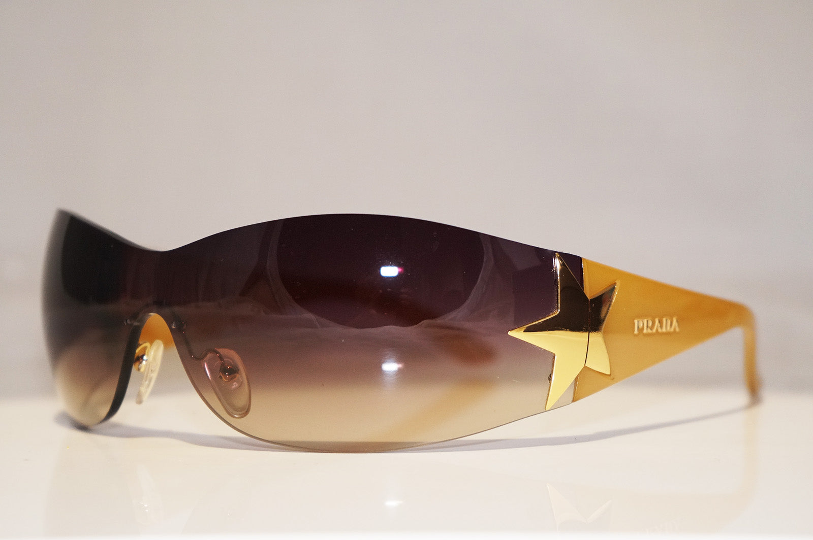PRADA Mens Unisex Designer Star Sunglasses Brown Shield SPR 72G 5AK-6S –  SunglassBlog