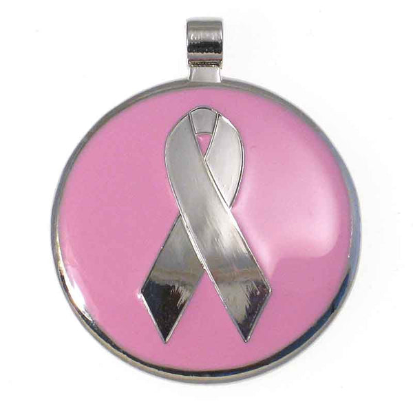 Round metal tag with pink enamel on the front surrounding a metal ribbon design