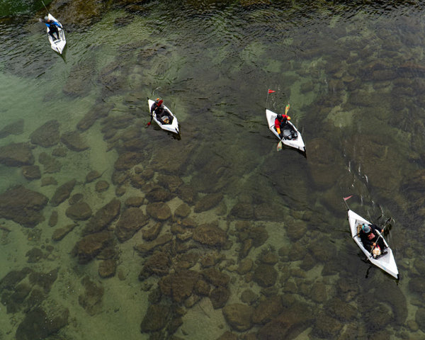 four people canoeing in their foldable canoes MyCanoe Solo