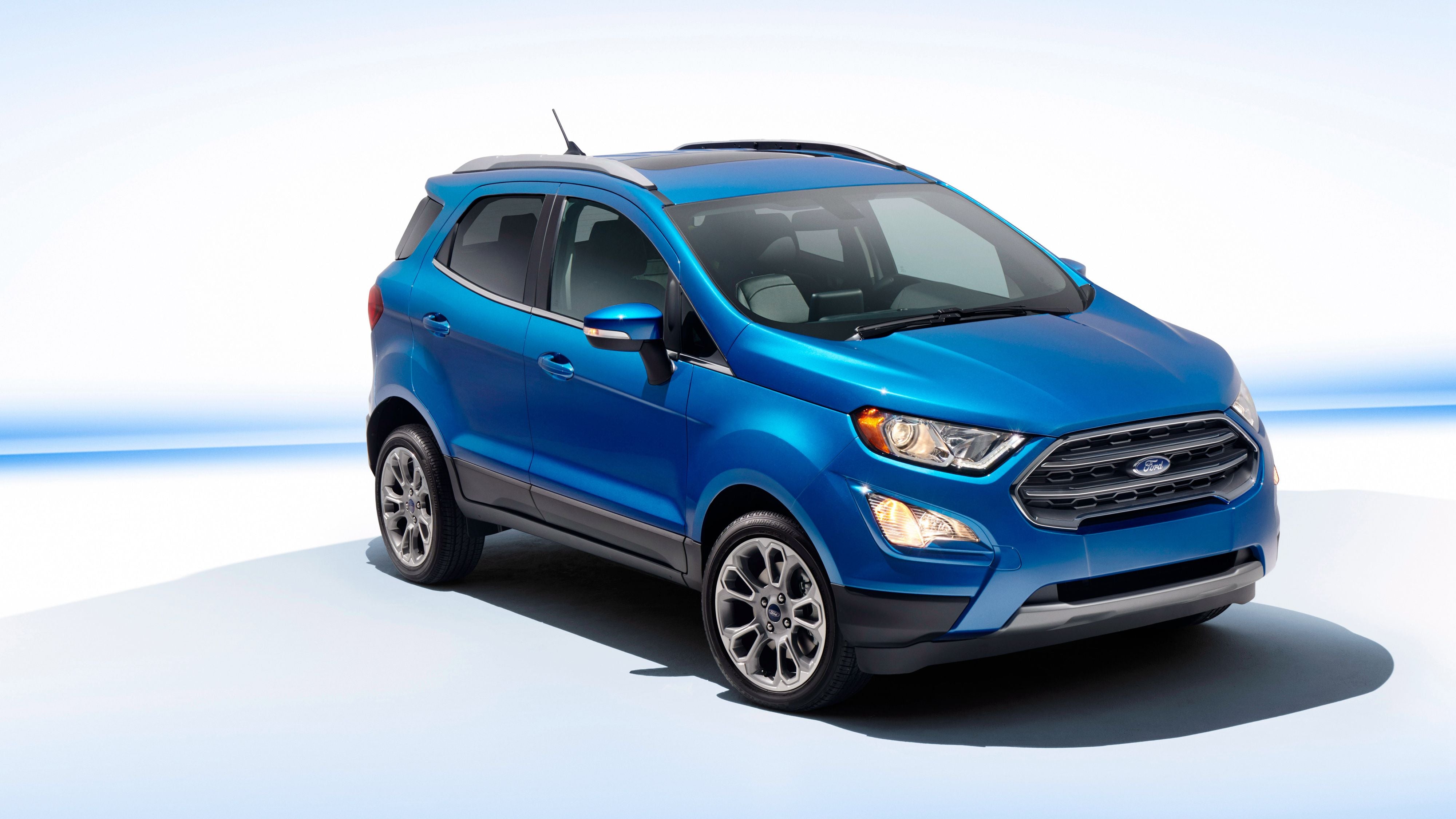 Blue color Ford SUV against a white background