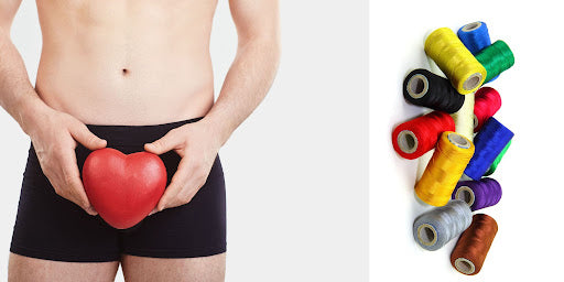 Torso and thighs of  man in black underwear holding a heart shaped toy at the left side of the image and nylon thread roles at the other end of the image  