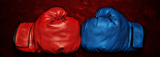 Boxing gloves in red and blue against each other 