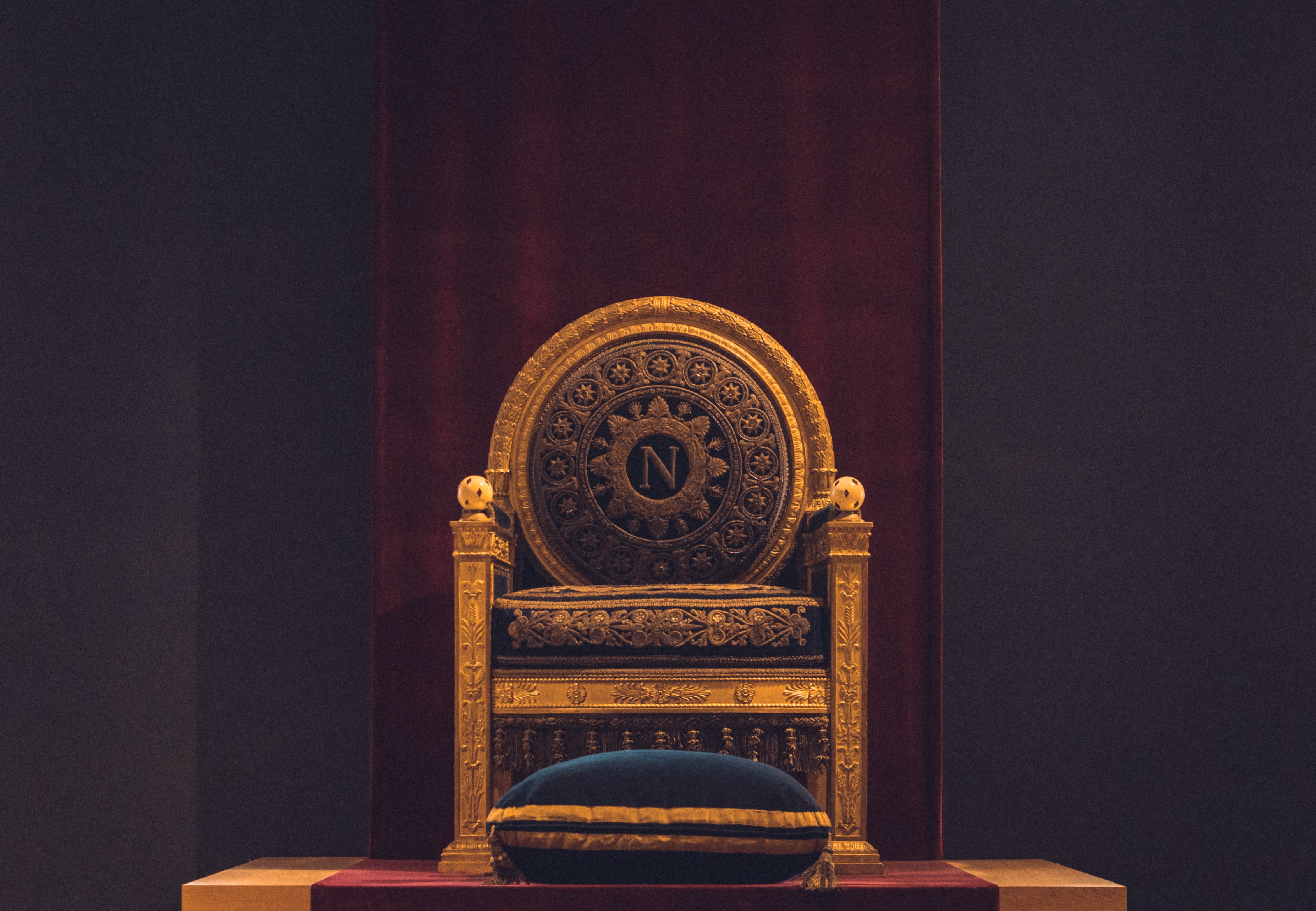 Golden chair in a dimly lit room