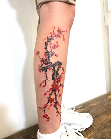 Blossoming tree plum flower tattoo