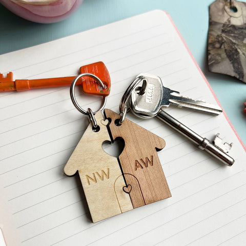 Couples together house keyrings in two different shades of wood. Personalised on each half.