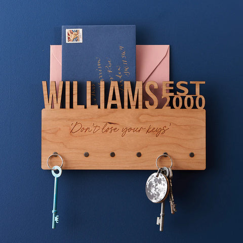 wooden key holder with the name "Williams" carved out along the top