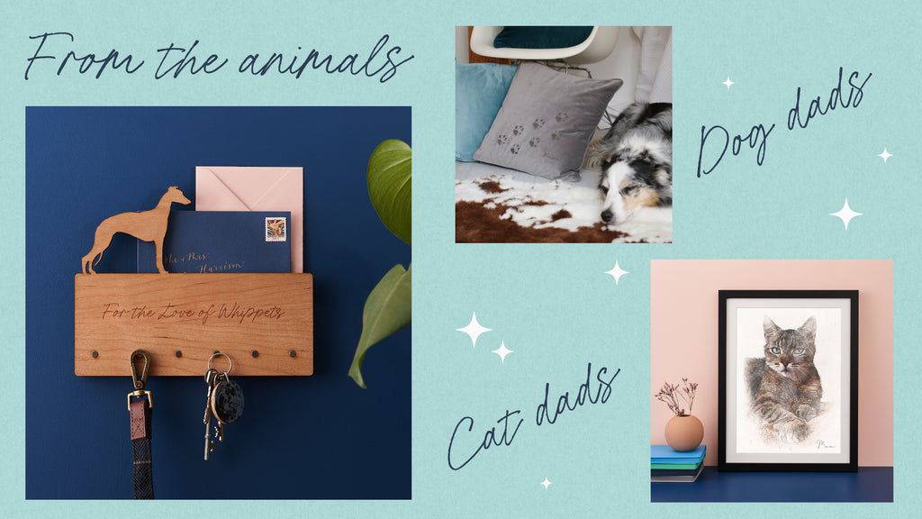 A wooden key rack with whippet in silhouette is on a navy wall. Next to that picture is an image of a sleeping collie next to a white rocking chair. On the chair is a grey cushion with diagonal paw prints running across the bottom corner. Next to that picture is a framed watercolour of a grey striped cat on a pink wall. Gifts from pets!